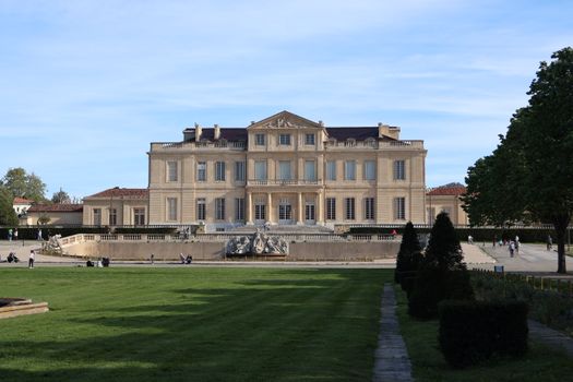 Majestic view of Château Borély surrounded by lush gardens in Marseille, France.