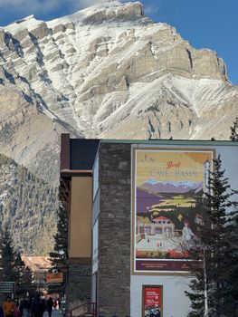 Vibrant Banff townscape with majestic snowy mountains, perfect for travel and nature themes.