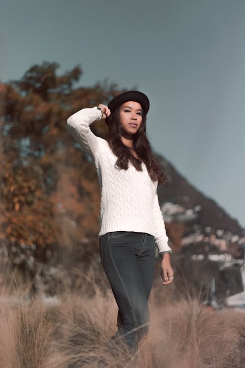 Woman Wearing White Sweater and Black Hat