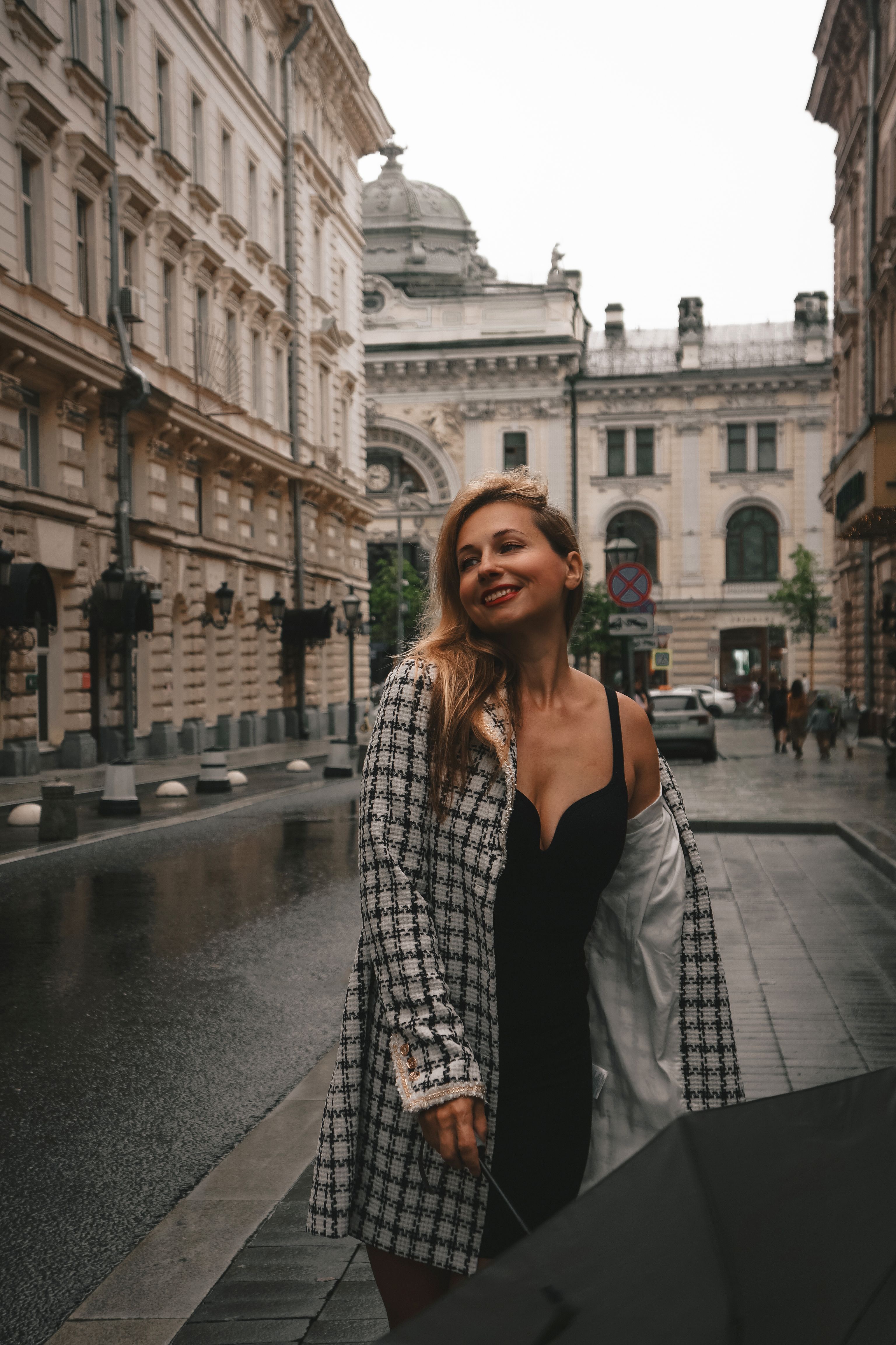 Stylish Woman Posed on Historic City Street · Free Stock Photo