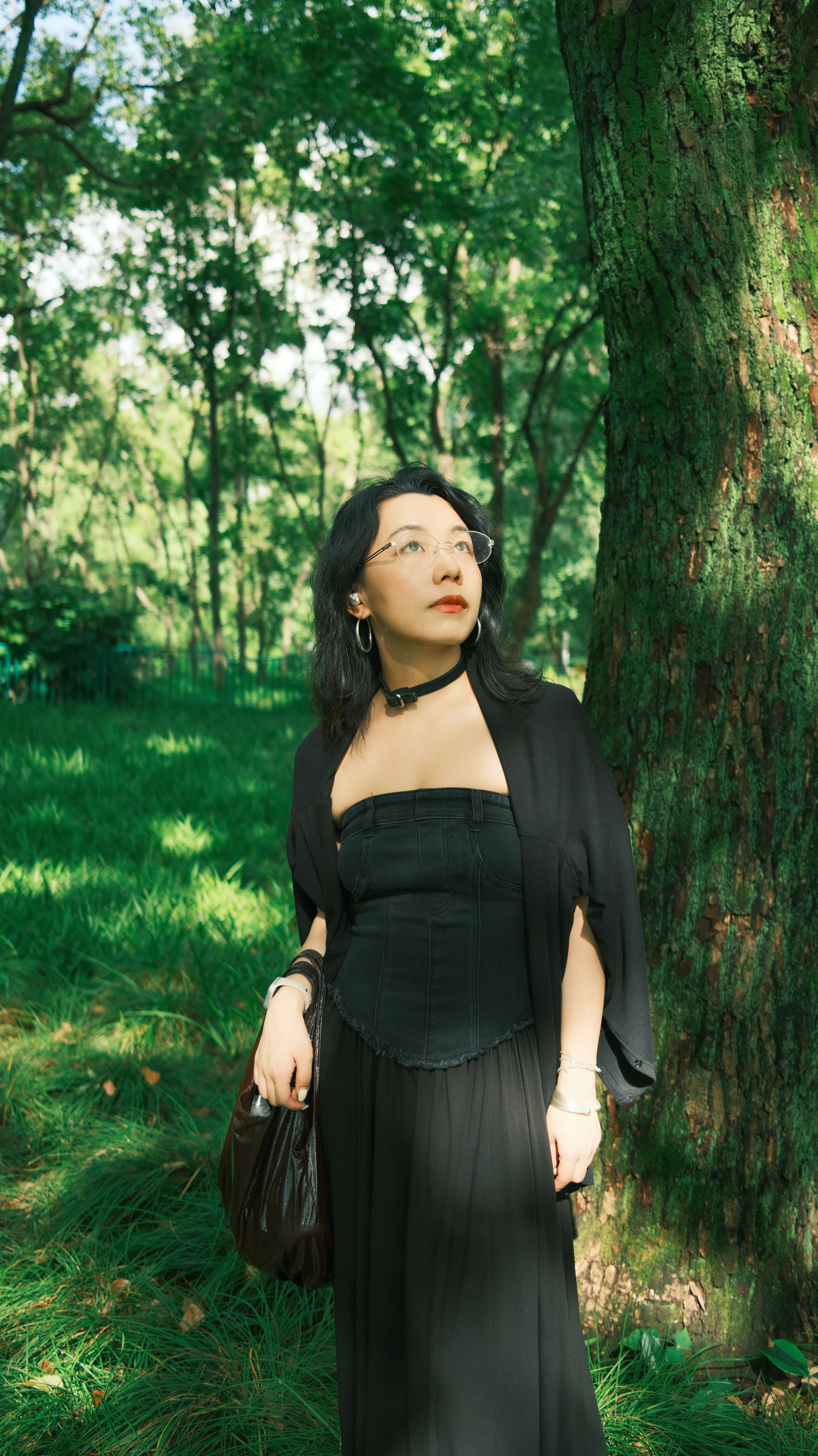 Woman in Black Dress Standing Beside Tree · Free Stock Photo