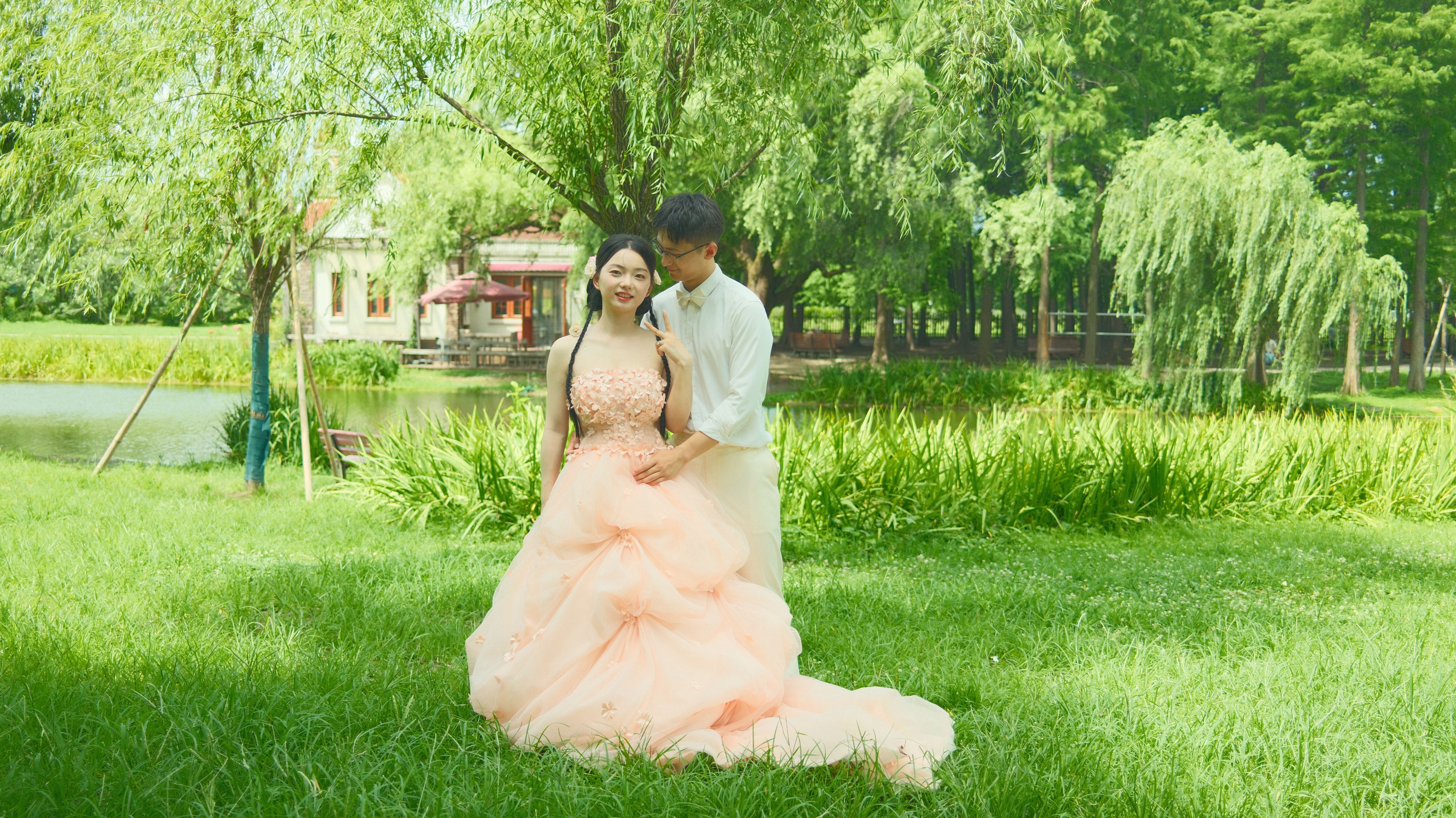 Couple embracing in a lush garden, glowing with romance and joy.