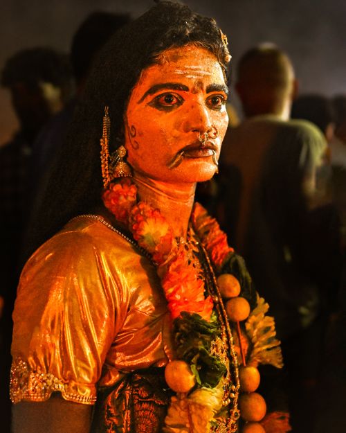 Free Person in traditional attire with intricate makeup at a Tamil Nadu festival. Stock Photo
