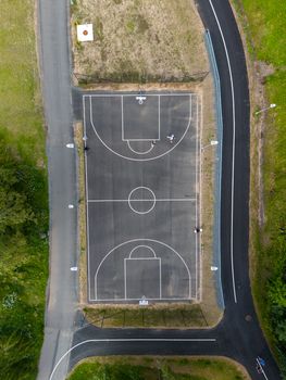 Aerial shot of an outdoor basketball court in Jönköping, Sweden, surrounded by roads and greenery.