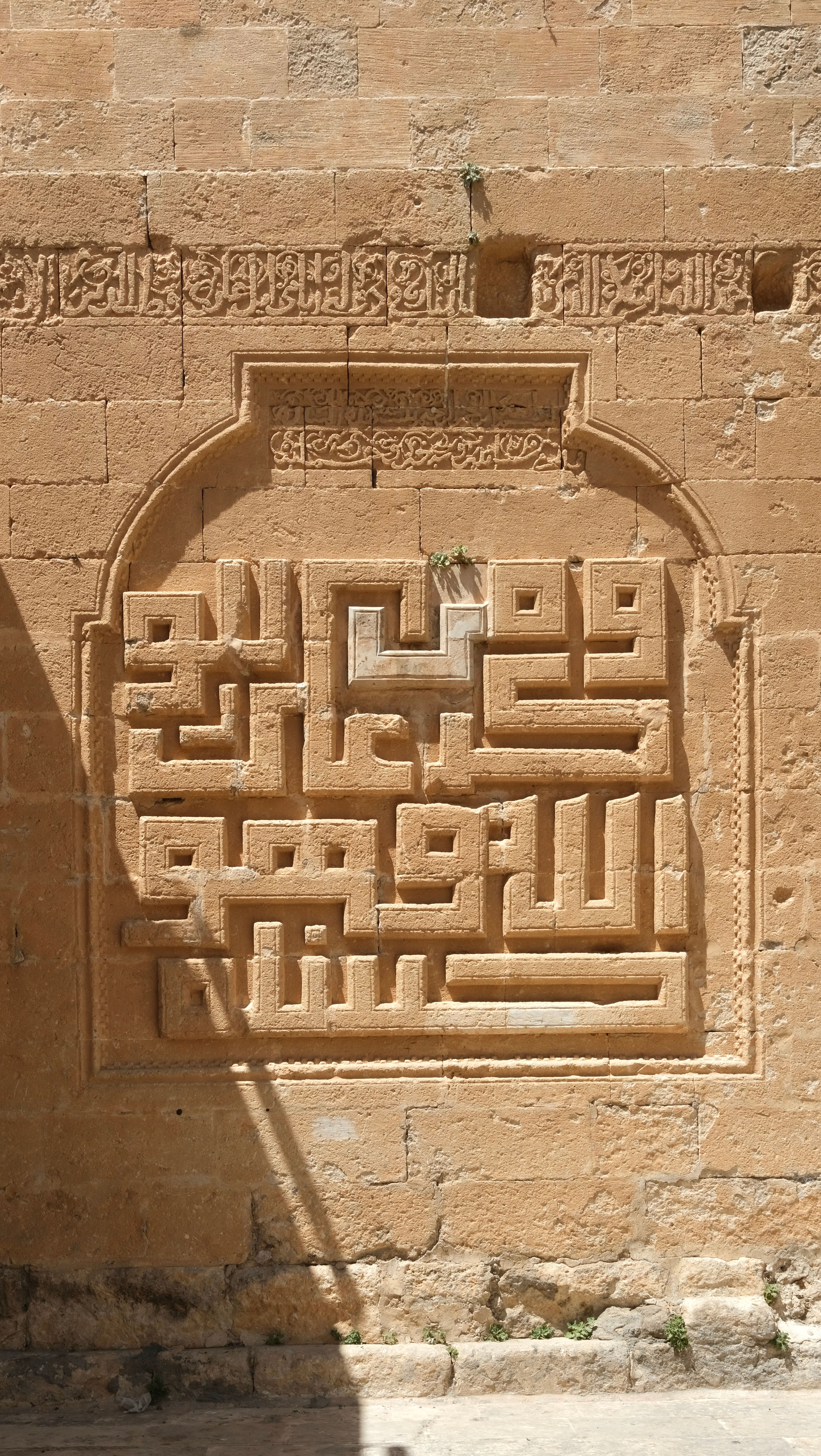 Ancient Arabic Calligraphy on Stone Wall · Free Stock Photo