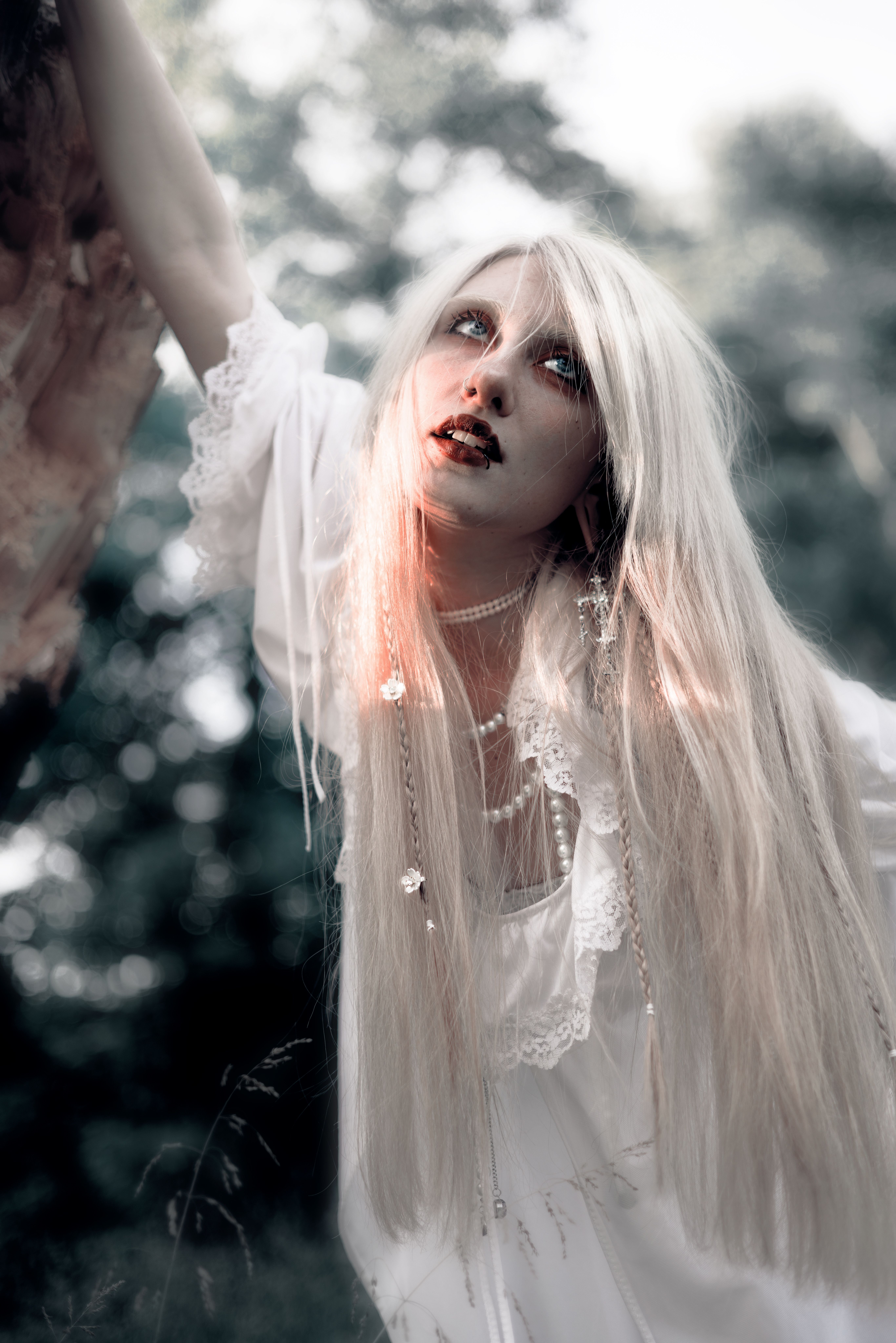 Mystical Woman in White Dress in Forest Setting · Free Stock Photo