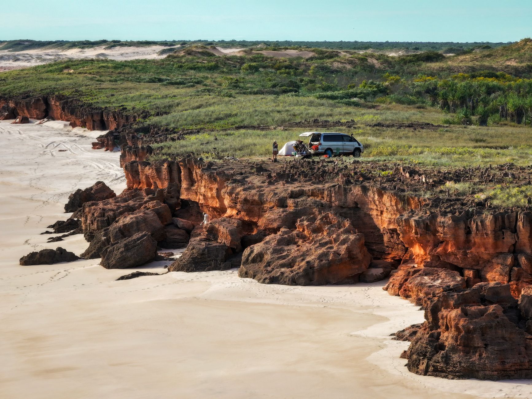 A campervan perched above the Kimberley coast, a reminder that remote trips are won by planning camp, water and daylight properly.