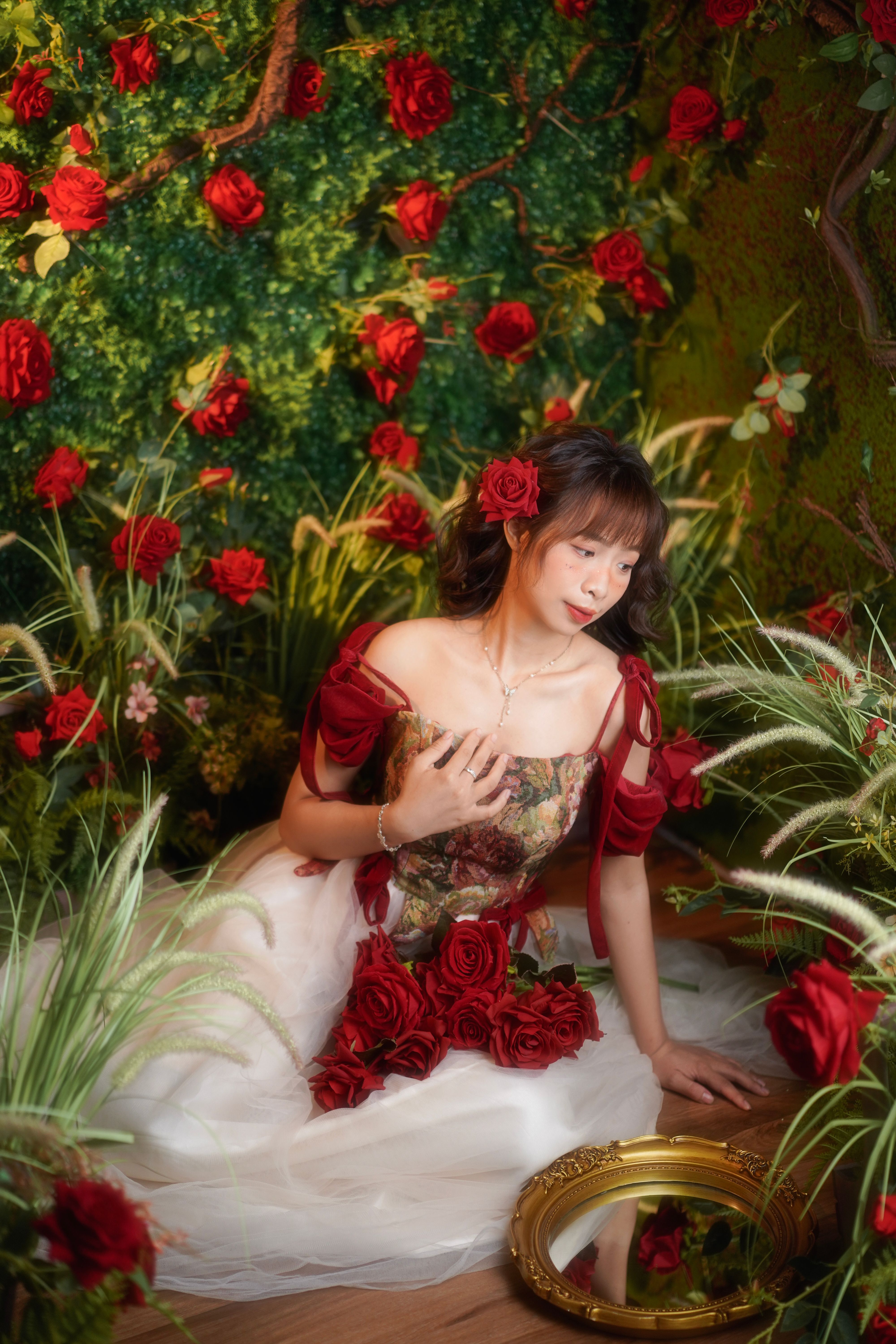 Elegant Woman in Floral Fantasy Setting with Roses  Free Stock Photo