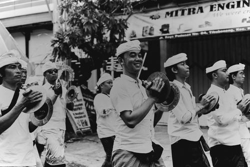 Free Black and white photo of a cultural parade with men playing cymbals, showcasing tradition. Stock Photo