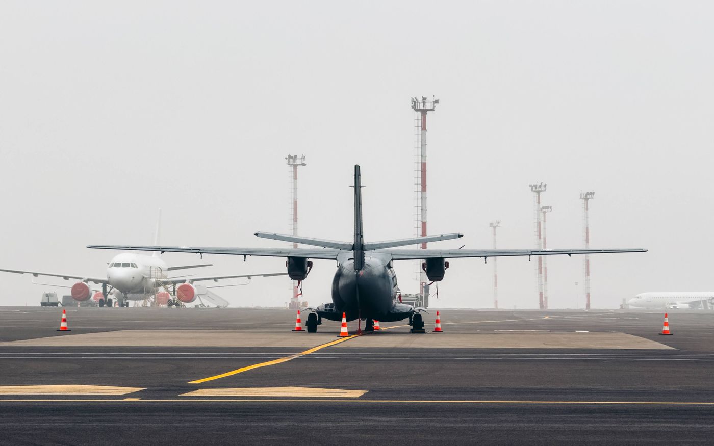 Aircraft waiting to depart at Vilnius Airport on a foggy day