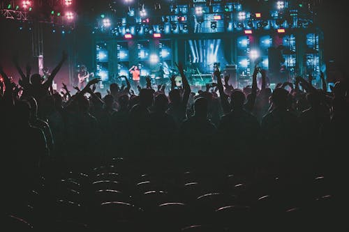 Photo Of People Raising Their Hands Up