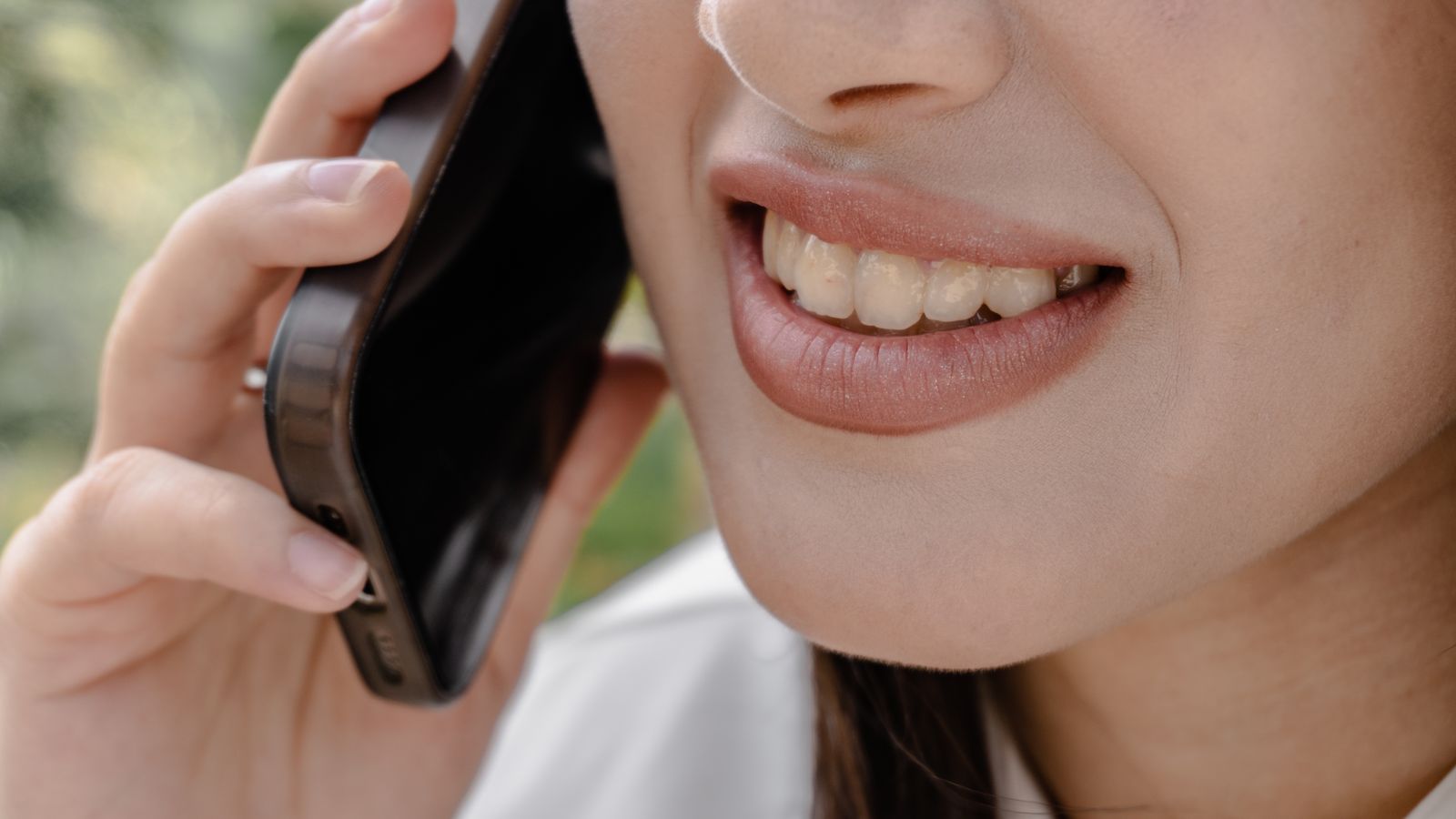 A person scrolling through a contacts list on a smartphone