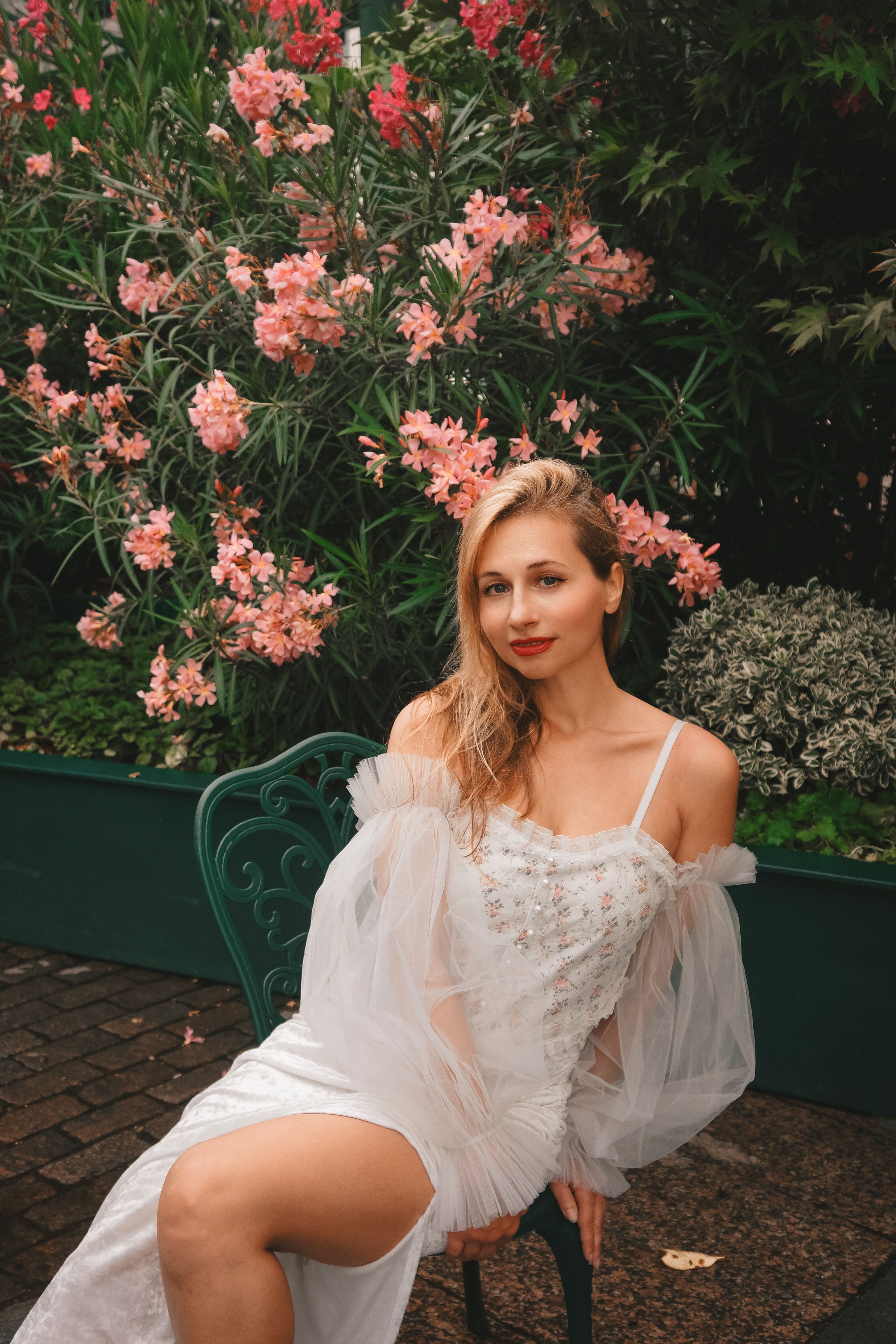 Elegant Woman Posing in Garden Setting · Free Stock Photo