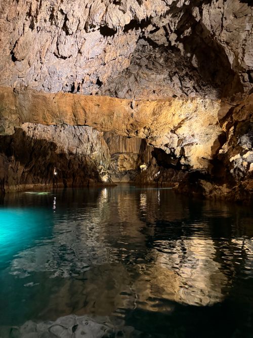 Free Explore a vast underground cave with striking water reflections and rugged rock formations. Stock Photo