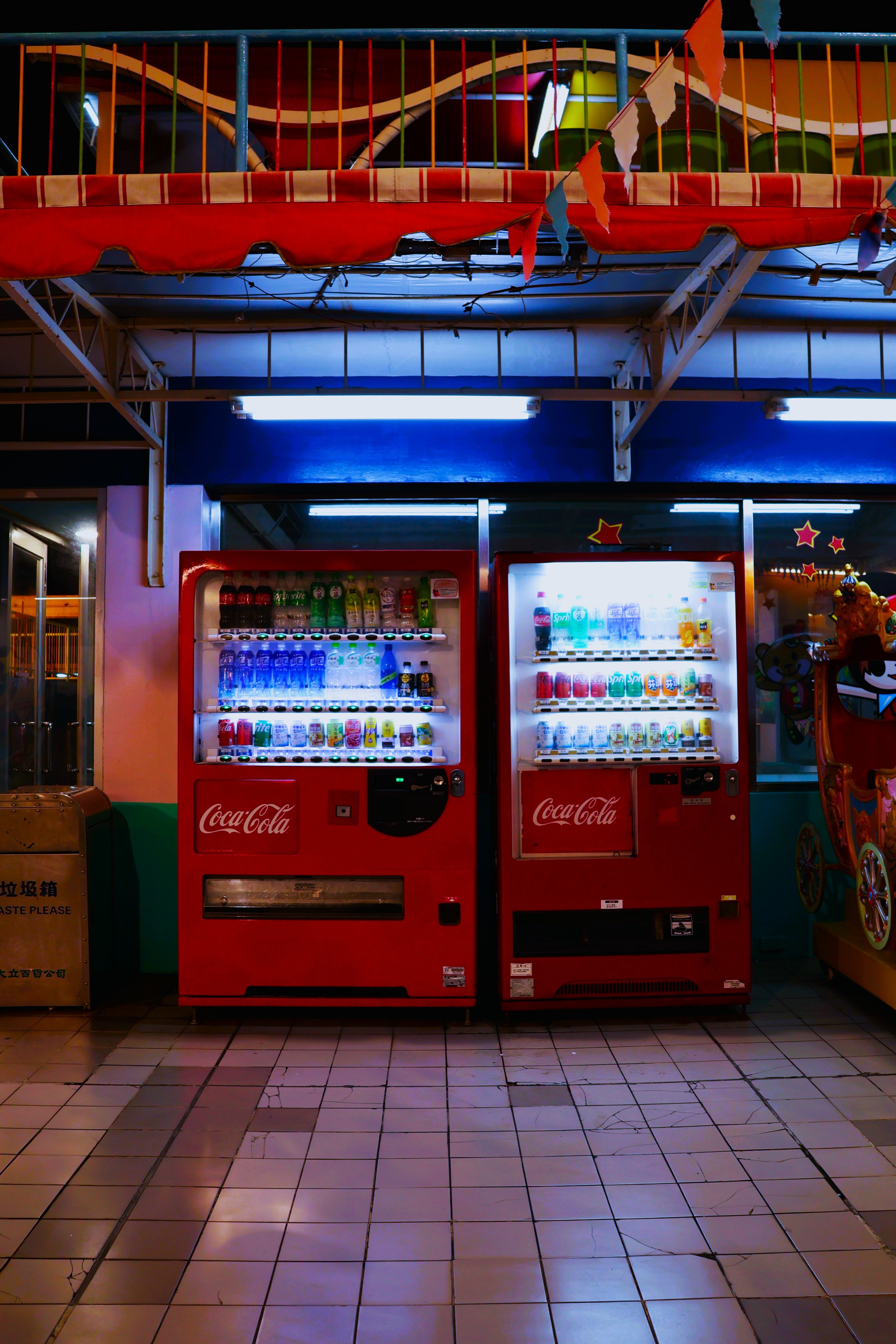 Colorful Night Scene with Coca-Cola Vending Machines · Free Stock Photo