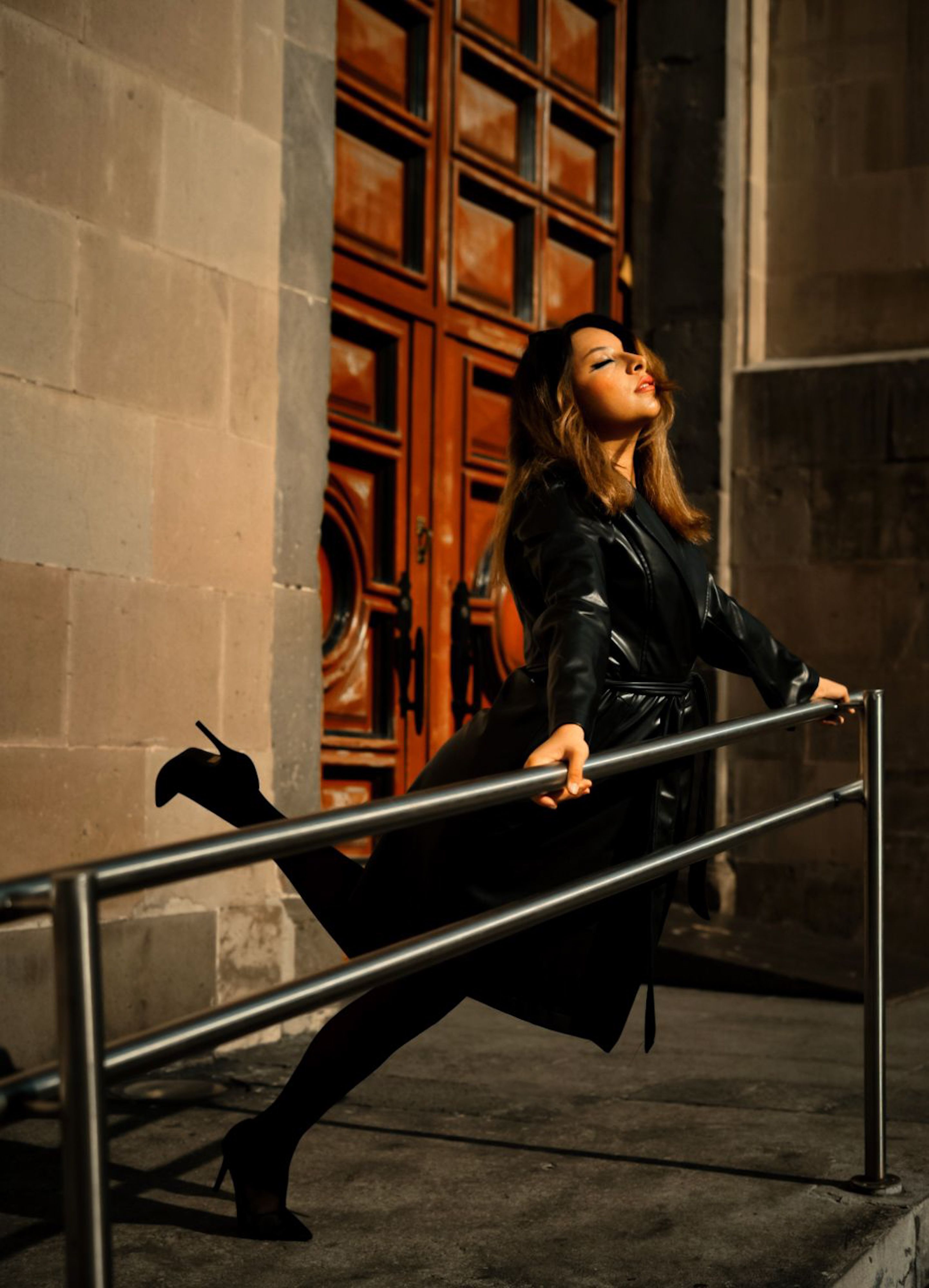 Elegant Woman Posing in Urban Setting · Free Stock Photo