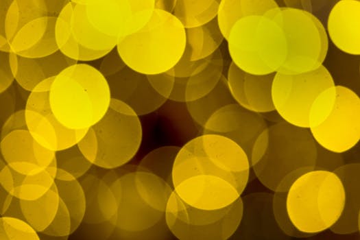 Captivating abstract bokeh with vibrant yellow circles, perfect for festive themes.
