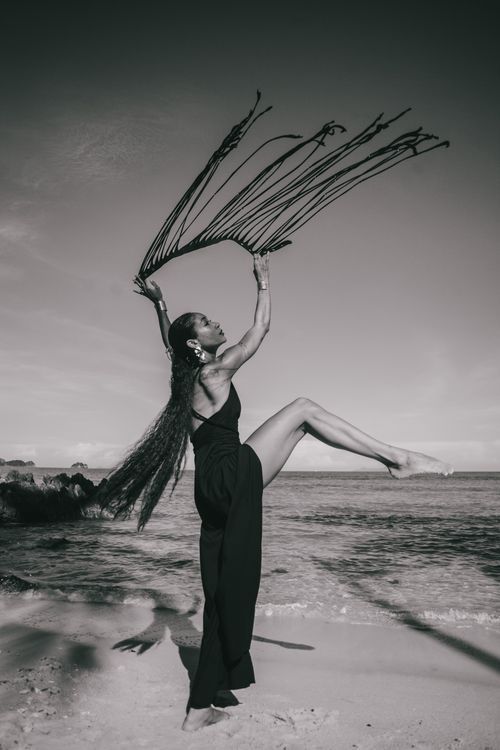 Free Black and white photo of a woman dancing gracefully on Samui beach, Thailand. Stock Photo