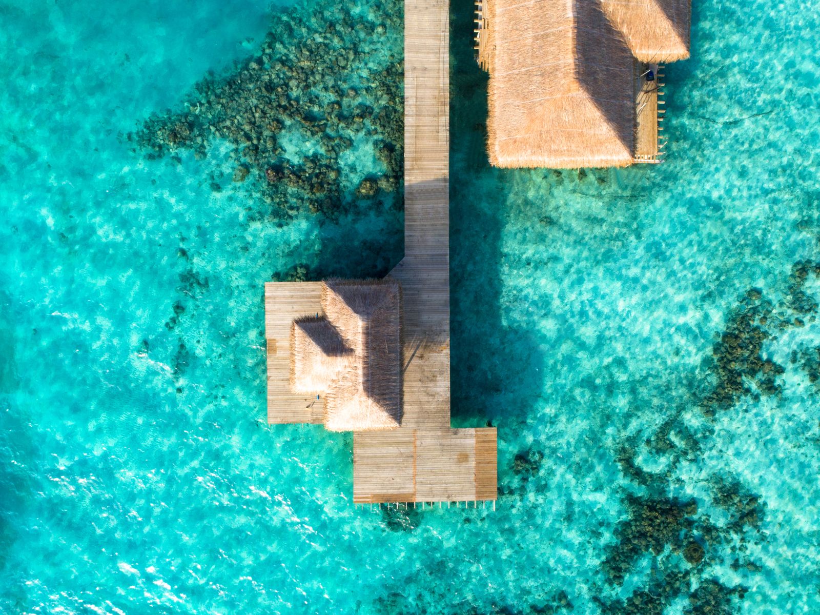 Aerial view of turquoise lagoon and island, Maldives