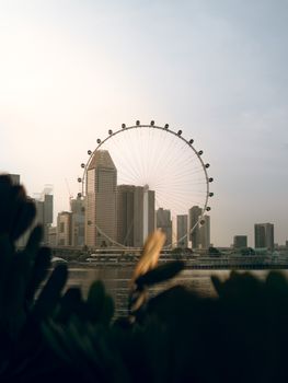 Capture of Singapore's skyline featuring the Singapore Flyer and modern skyscrapers.