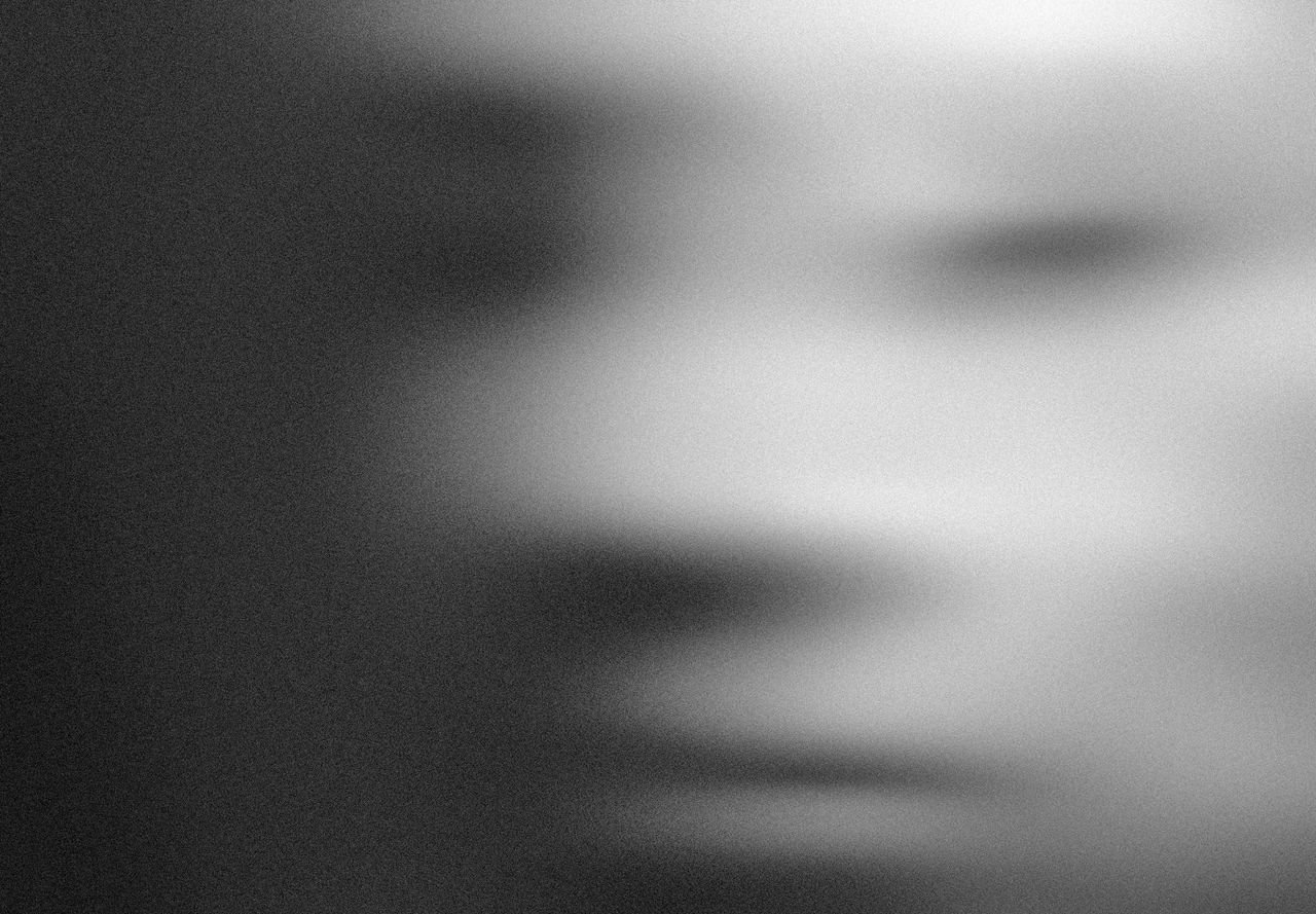 blurred grayscale abstract portrait creating a mysterious effect