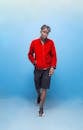 Fashionable Young Man in Red Jacket Posing