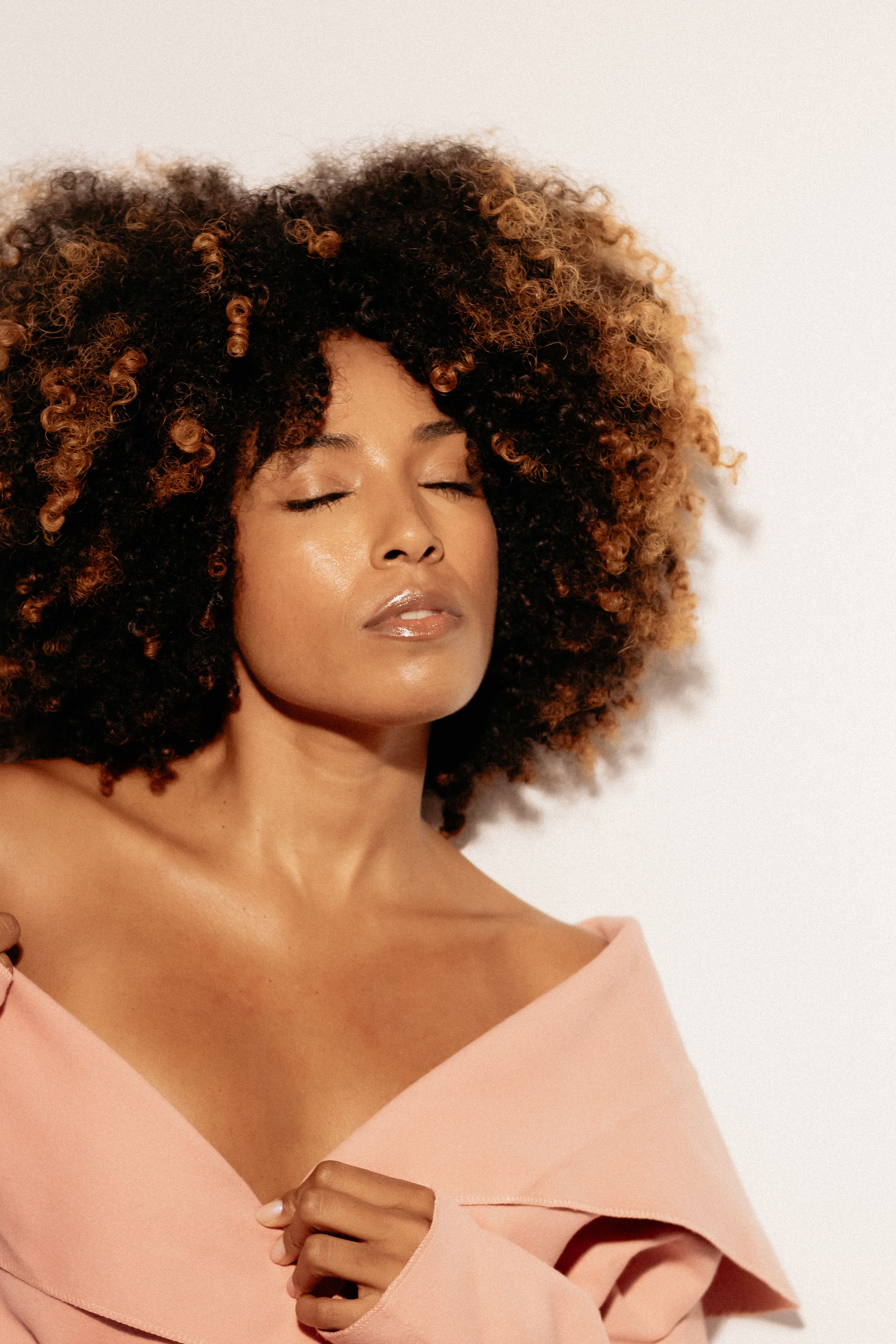 Elegant Portrait of Woman with Curly Hair · Free Stock Photo
