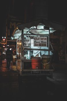 Atmospheric photo of a street food cart at night in Istanbul, Turkey.