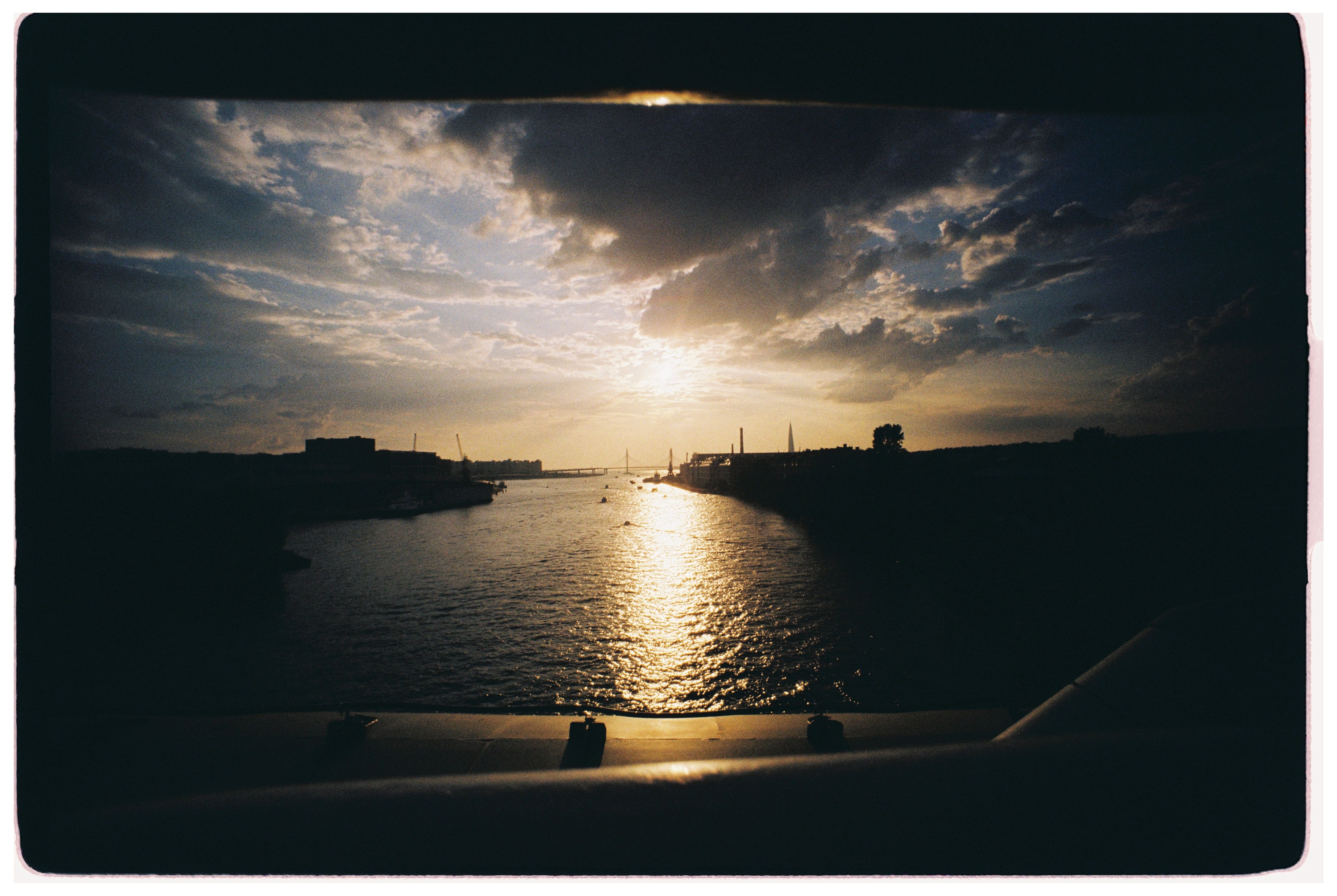 Scenic River Sunset Silhouette with Dramatic Sky · Free Stock Photo