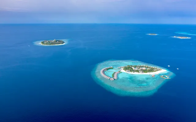 A tropical island surrounded by turquoise water