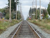 Long Railway Tracks Leading to Horizon