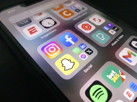 Close-up view of a smartphone screen featuring popular social media application icons.