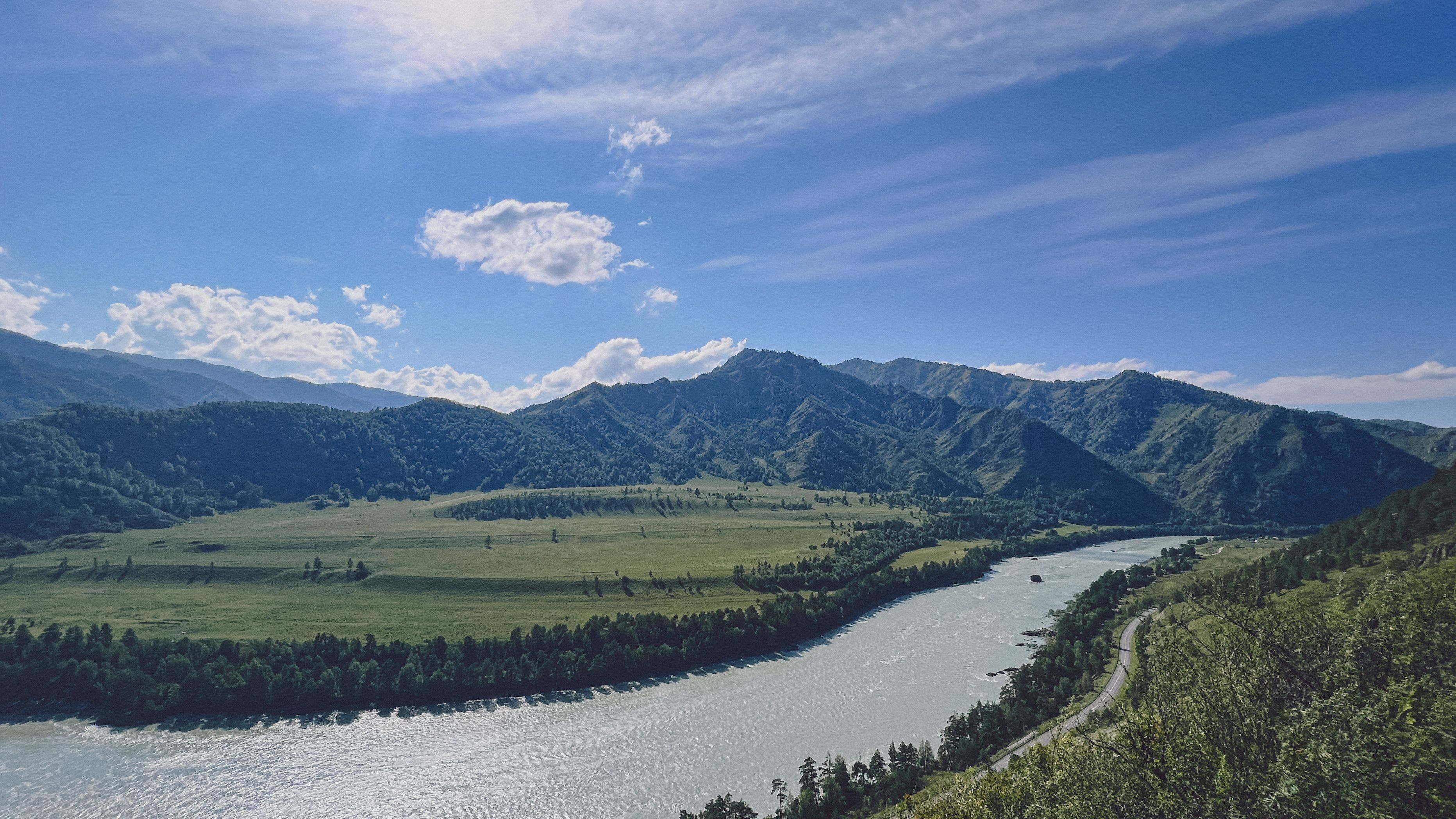 Scenic Mountain View with River and Blue Sky · Free Stock Photo