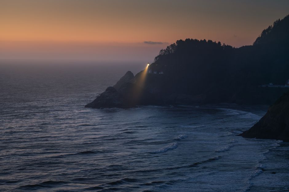 lighthouse beam night ocean