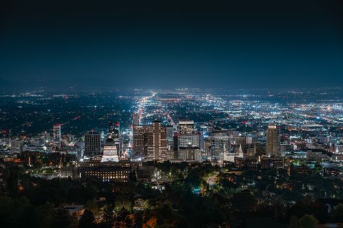 Free Beautiful nighttime aerial shot of Salt Lake City skyline with illuminated city lights and clear sky. Stock Photo