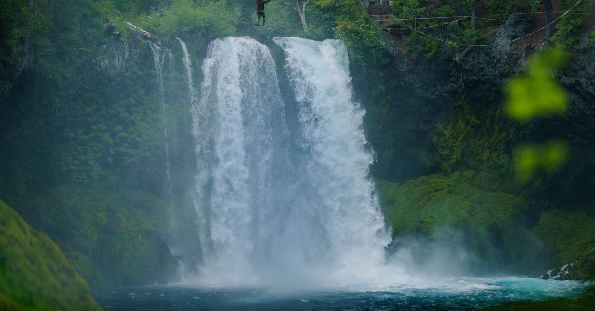 Waterfall Rocks Rope Bridge Adventurer Crossing Rope Bridge Above Waterfall · Free Stock Photo