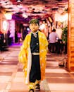 Boy in Vibrant Kimono Walking Indoors