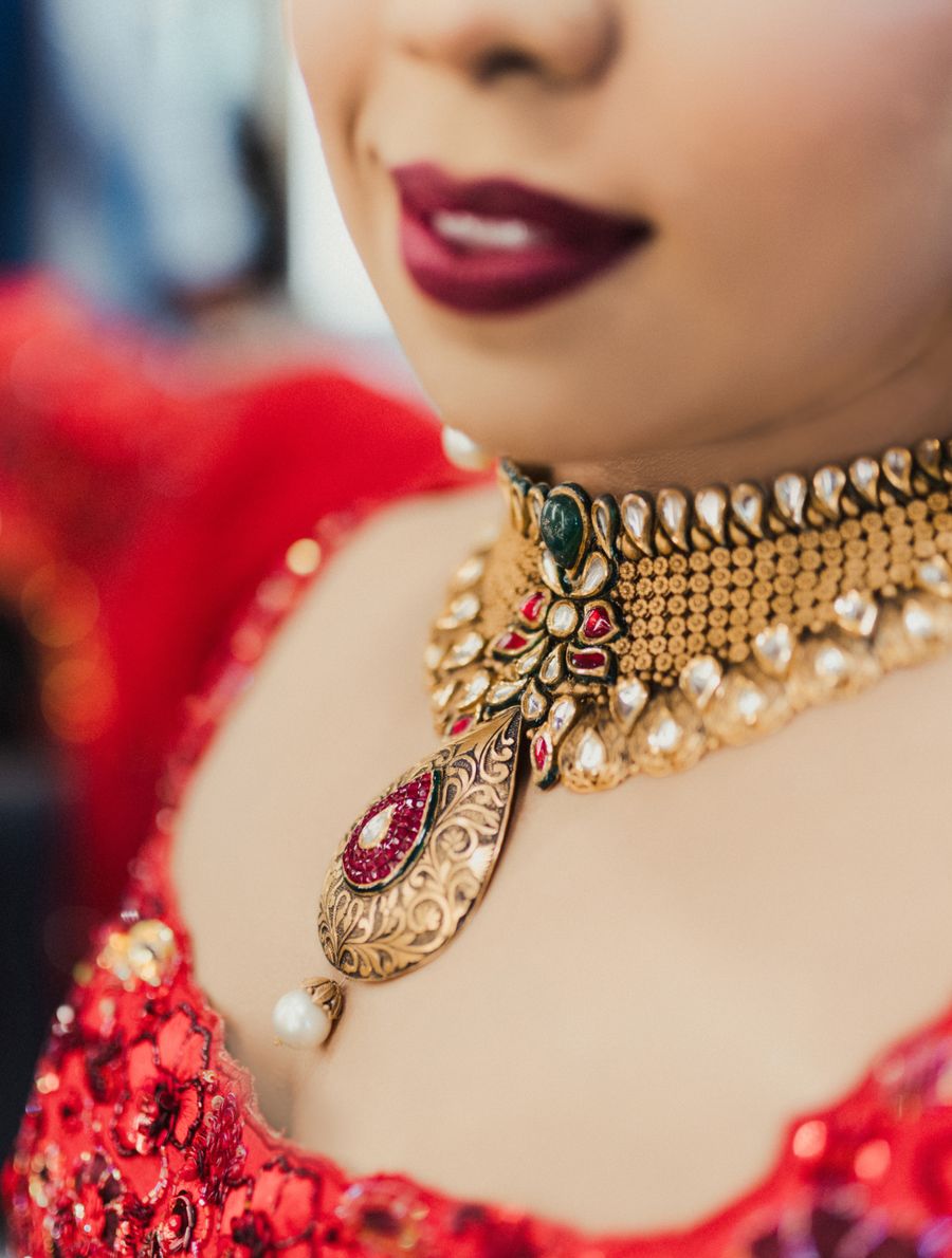 Bridal temple jewelry on red attire