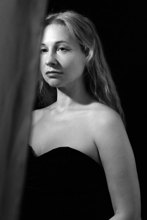 Free Black and white portrait of a woman in a strapless dress, conveying elegance and introspection. Stock Photo