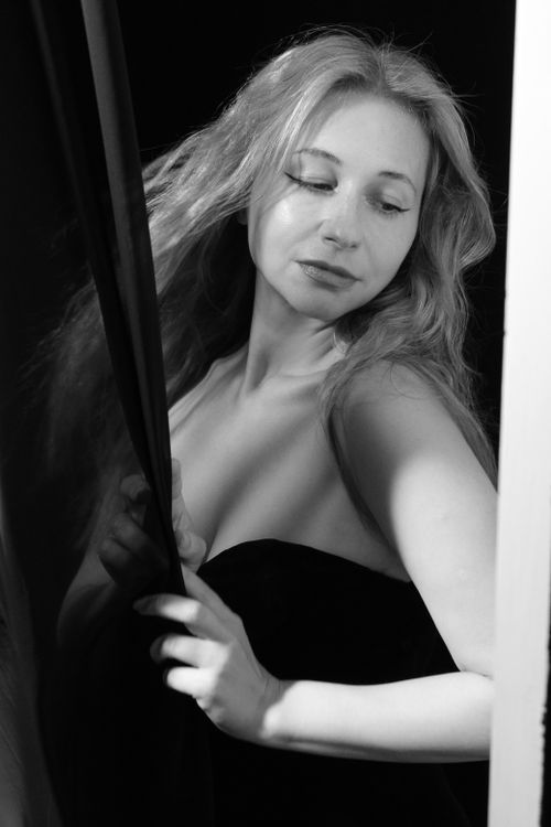 Free Black and white portrait of a woman with long hair draped in fabric. Stock Photo