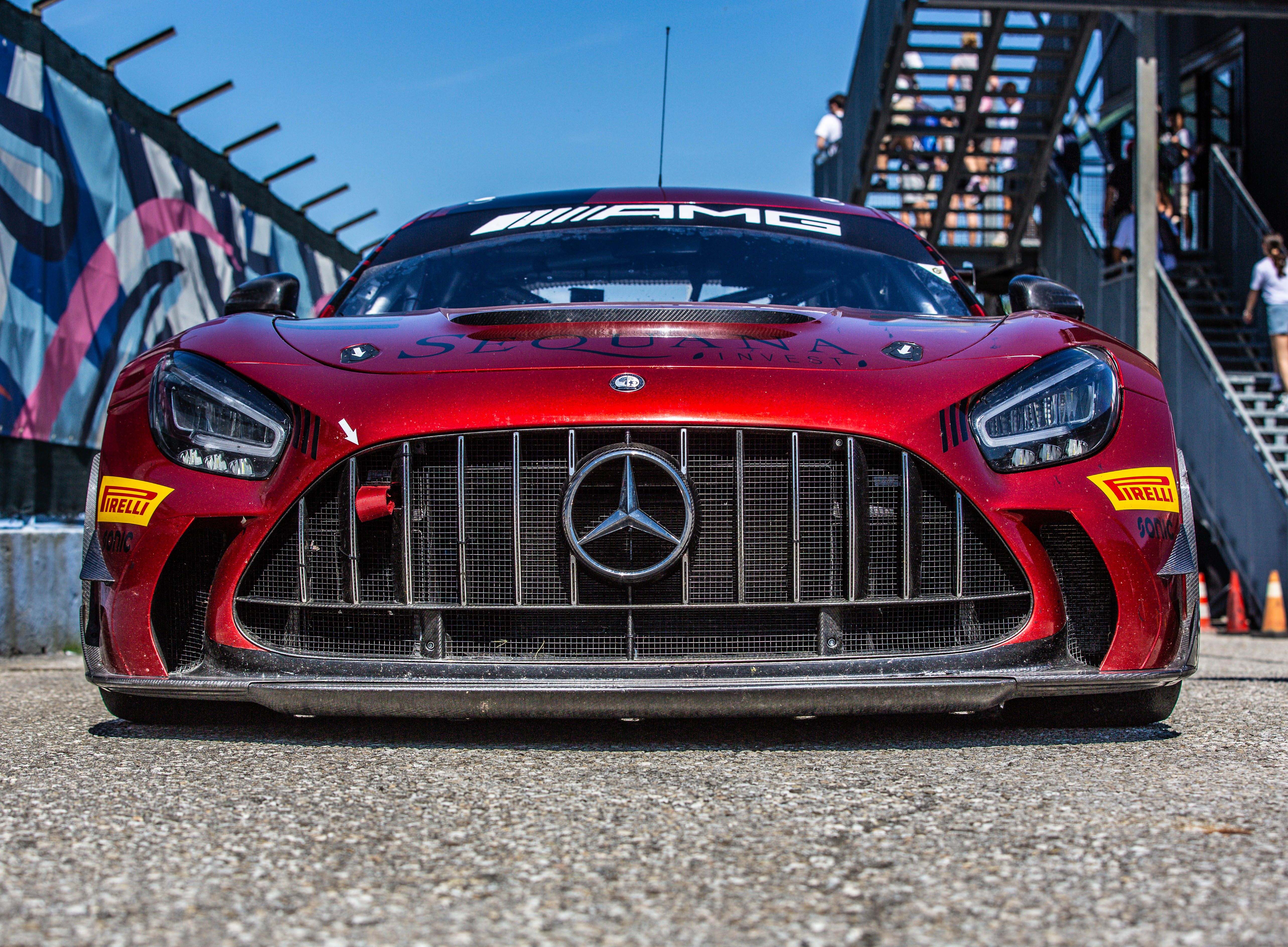 Red Mercedes-AMG Race Car at Trackside Event · Free Stock Photo