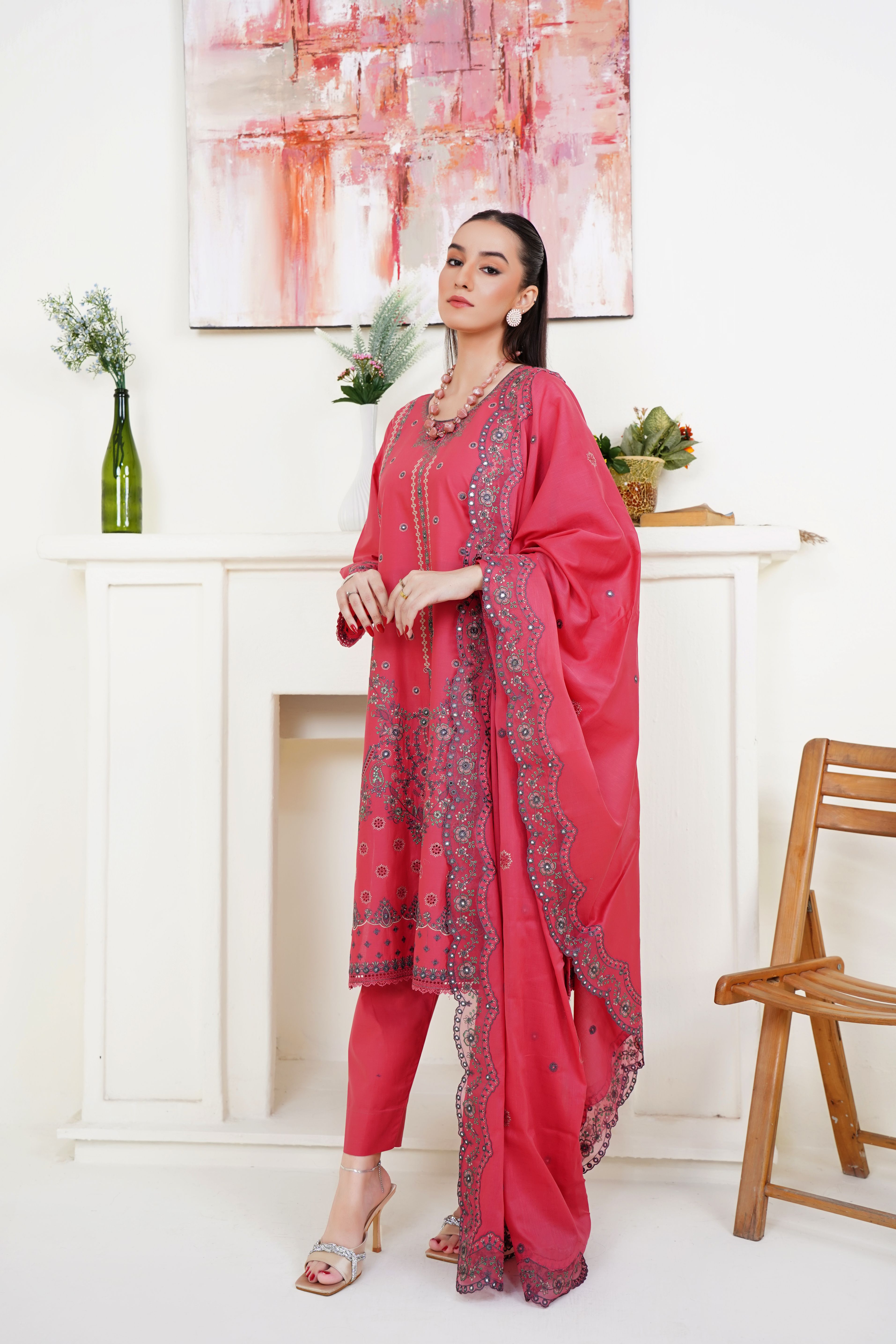 Stylish fashion model in traditional South Asian attire posing in a Lahore studio.