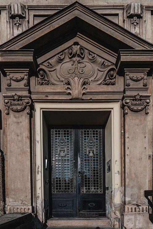 Free Intricate stone and iron doorway in Brno, showcasing historic European architectural details. Stock Photo