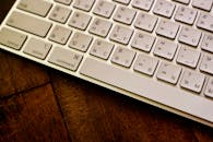 Thai Keyboard on Wooden Desk Close-Up