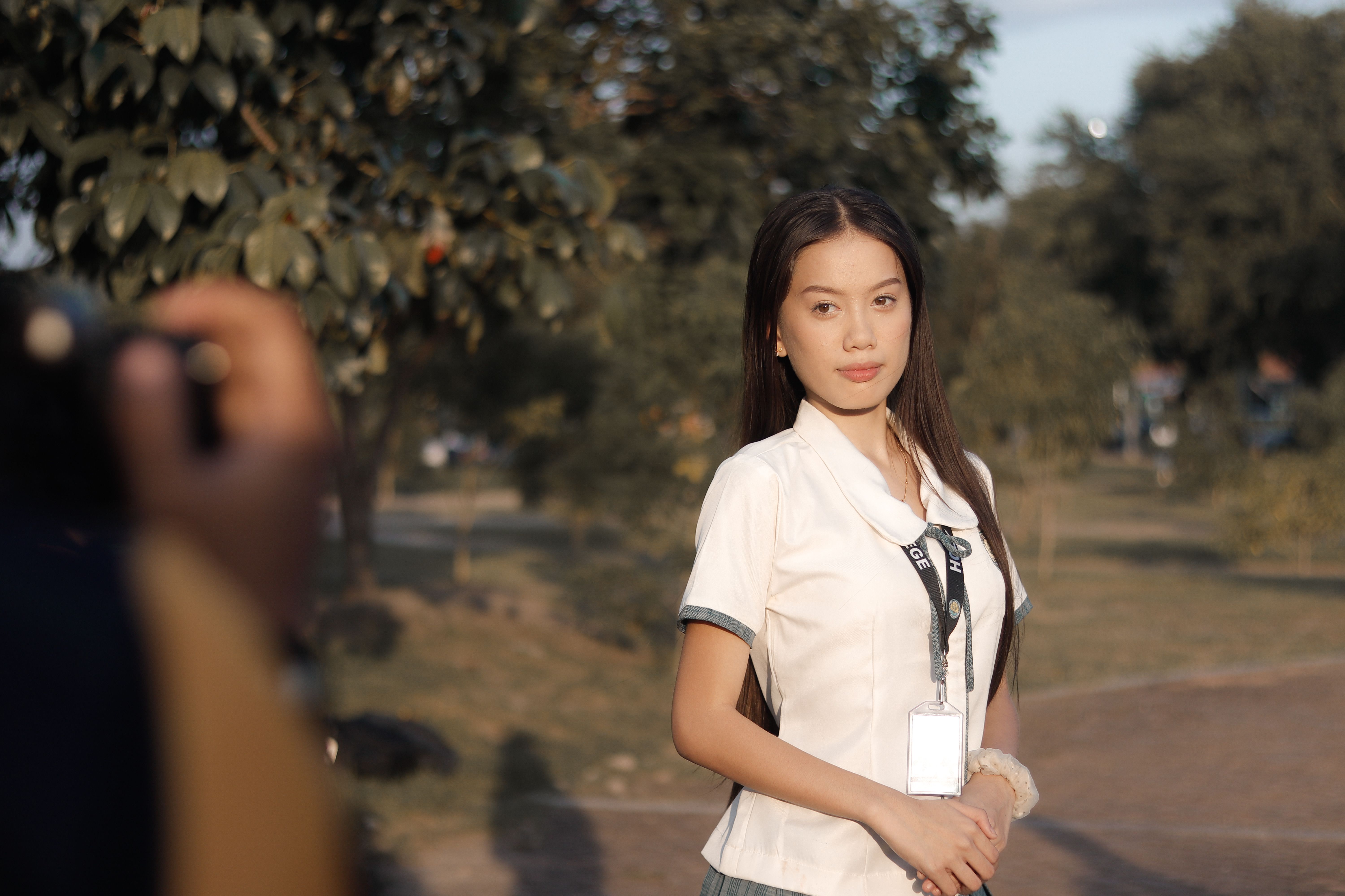 Young Woman Posing Outdoors in Casual Outfit