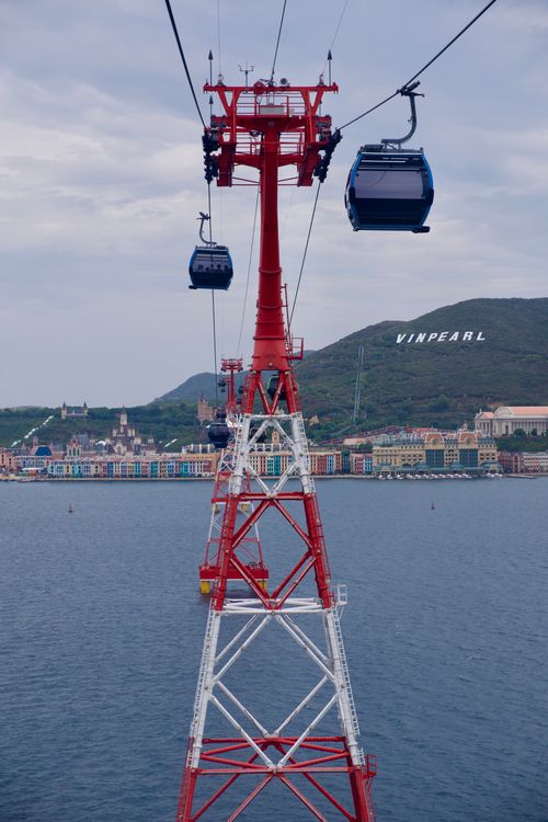 Free Cable cars over water leading to Vinpearl Land in Vietnam, offering a scenic aerial view. Stock Photo