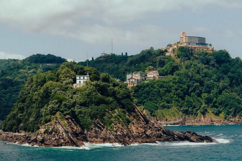 View of Monte Igueldo hill and its tower amusement park in San Sebastián, Spain