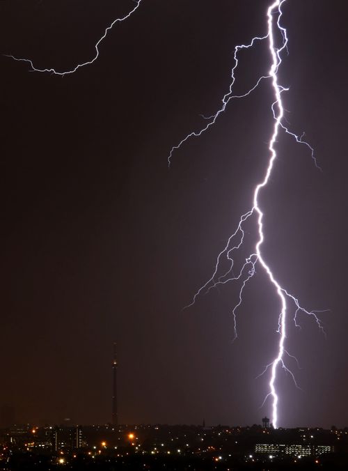 Free Striking night view of a lightning bolt over Johannesburg's skyline during a storm. Stock Photo