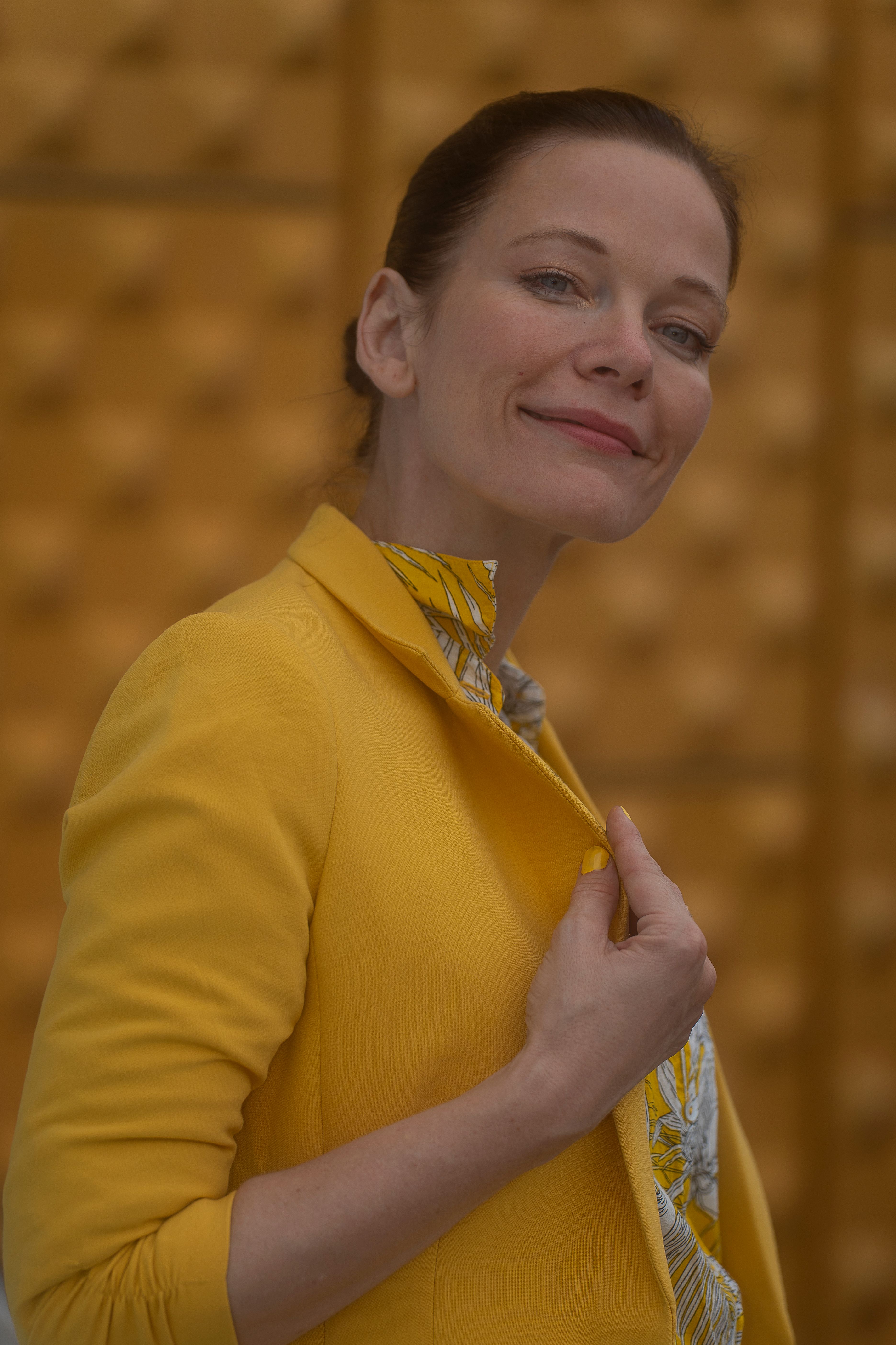 Stylish Woman Posing in Yellow Jacket in Berlin · Free Stock Photo