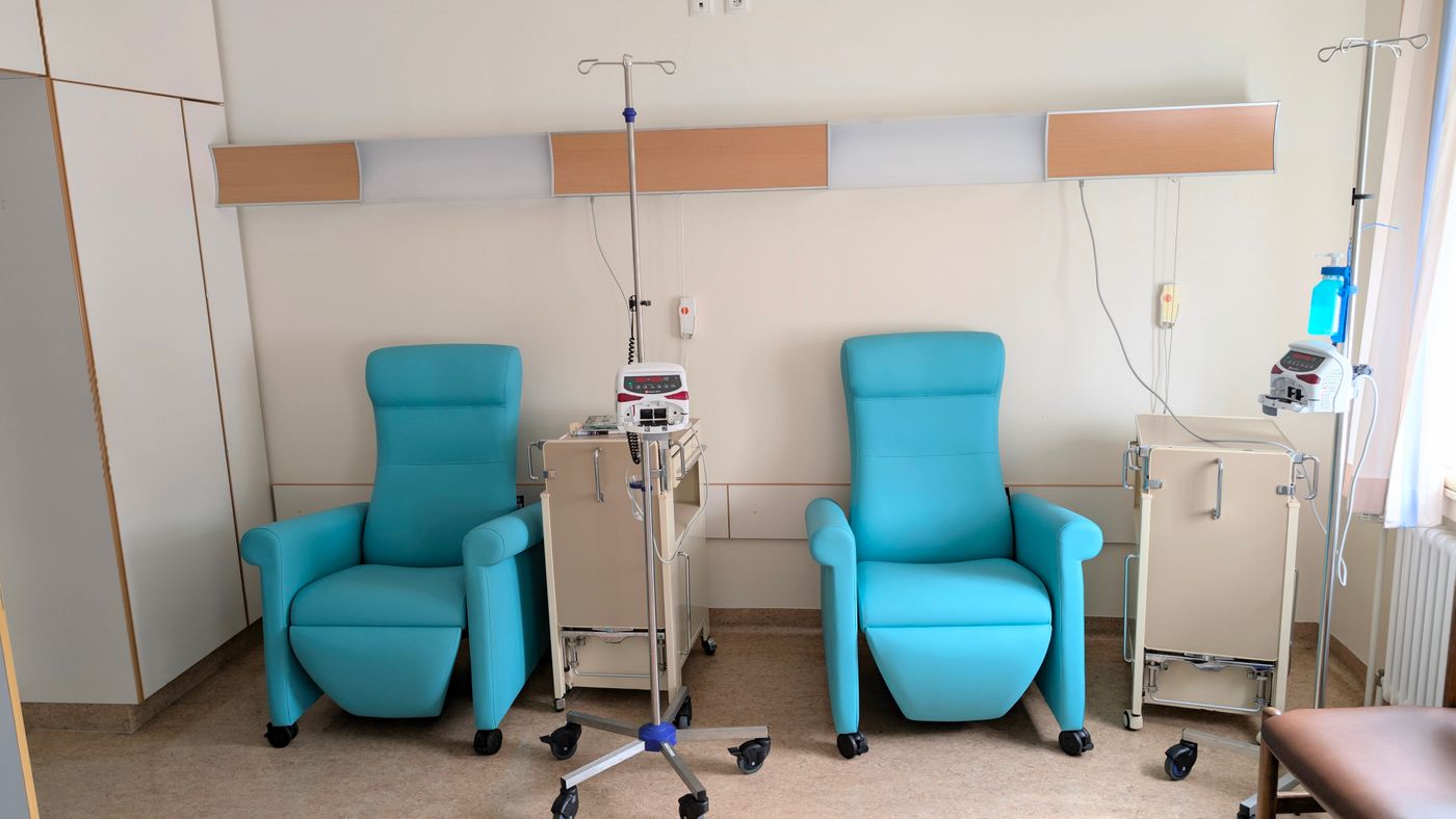 A calm hospital treatment room with infusion chairs